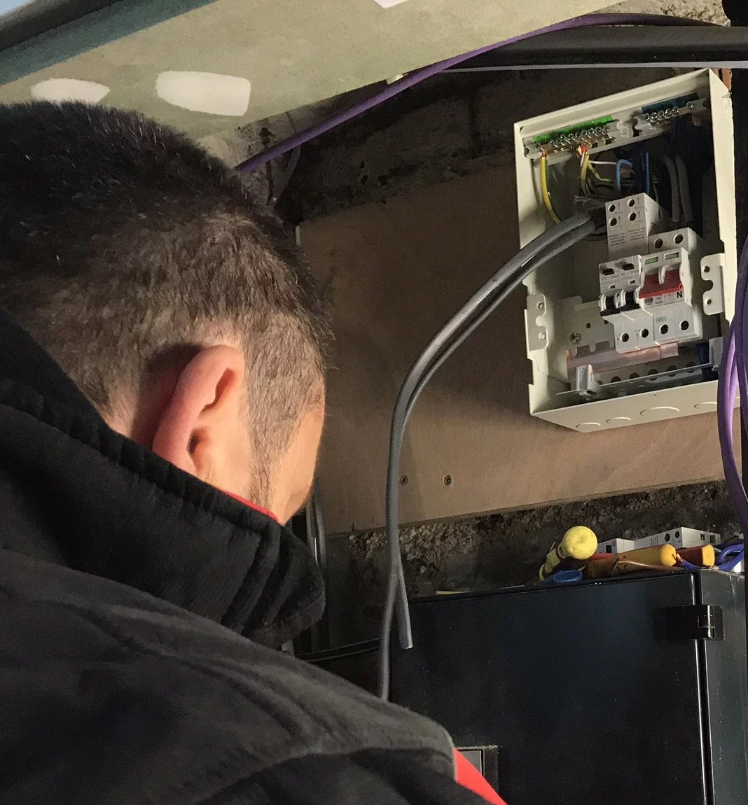 Electrician working on cables