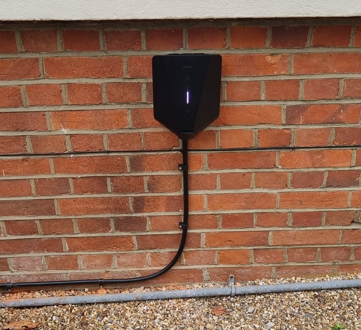 Electric vehicle charger mounted on a wall.