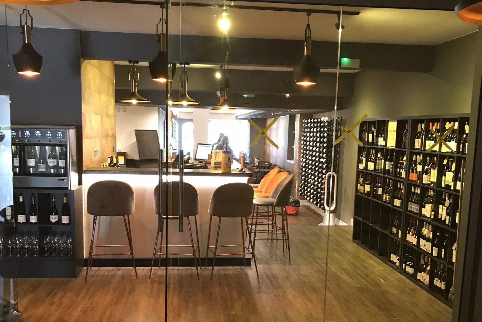 Completed electrical installation in a modern bar interior.