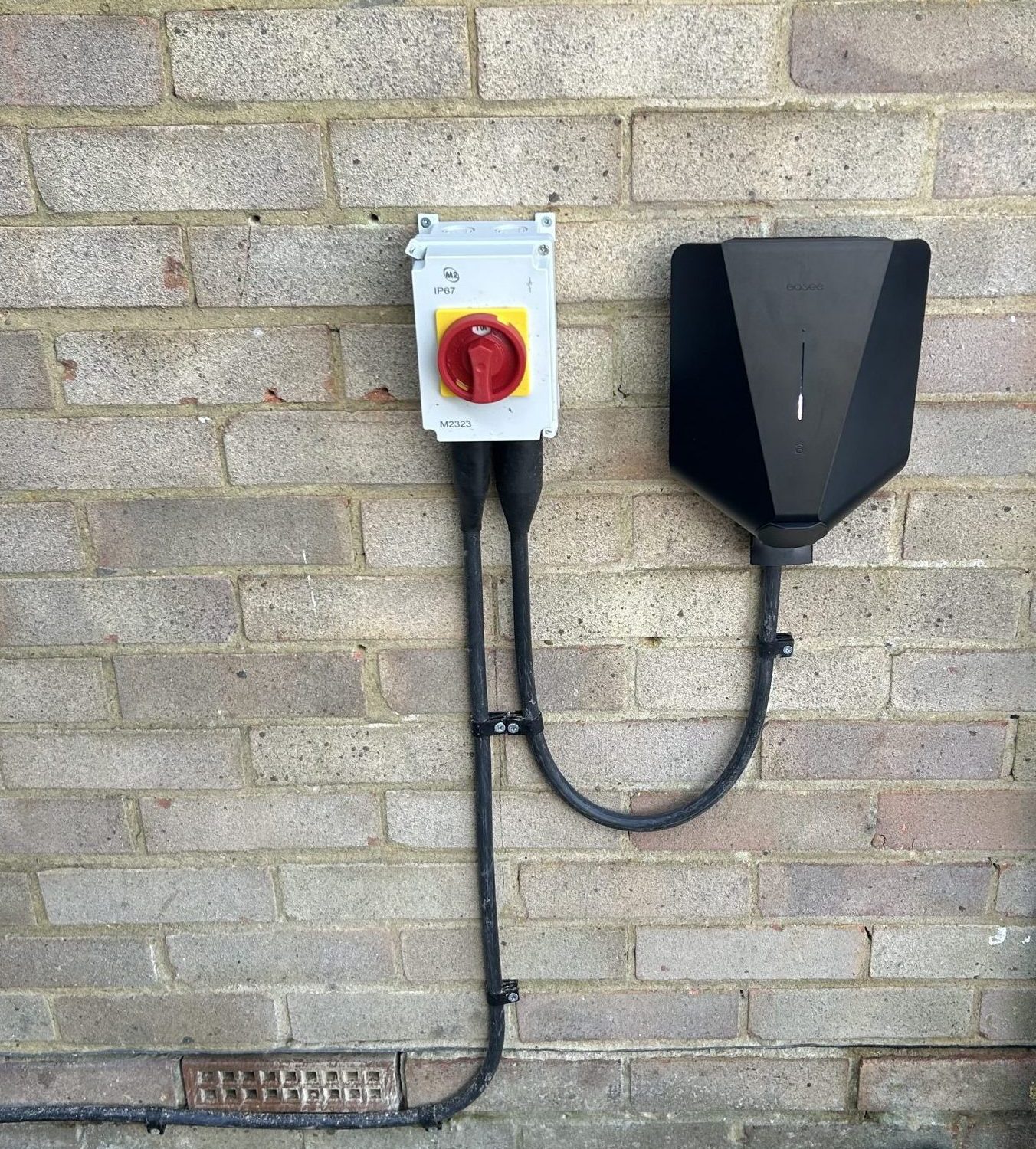 Electric vehicle charger mounted on a wall.