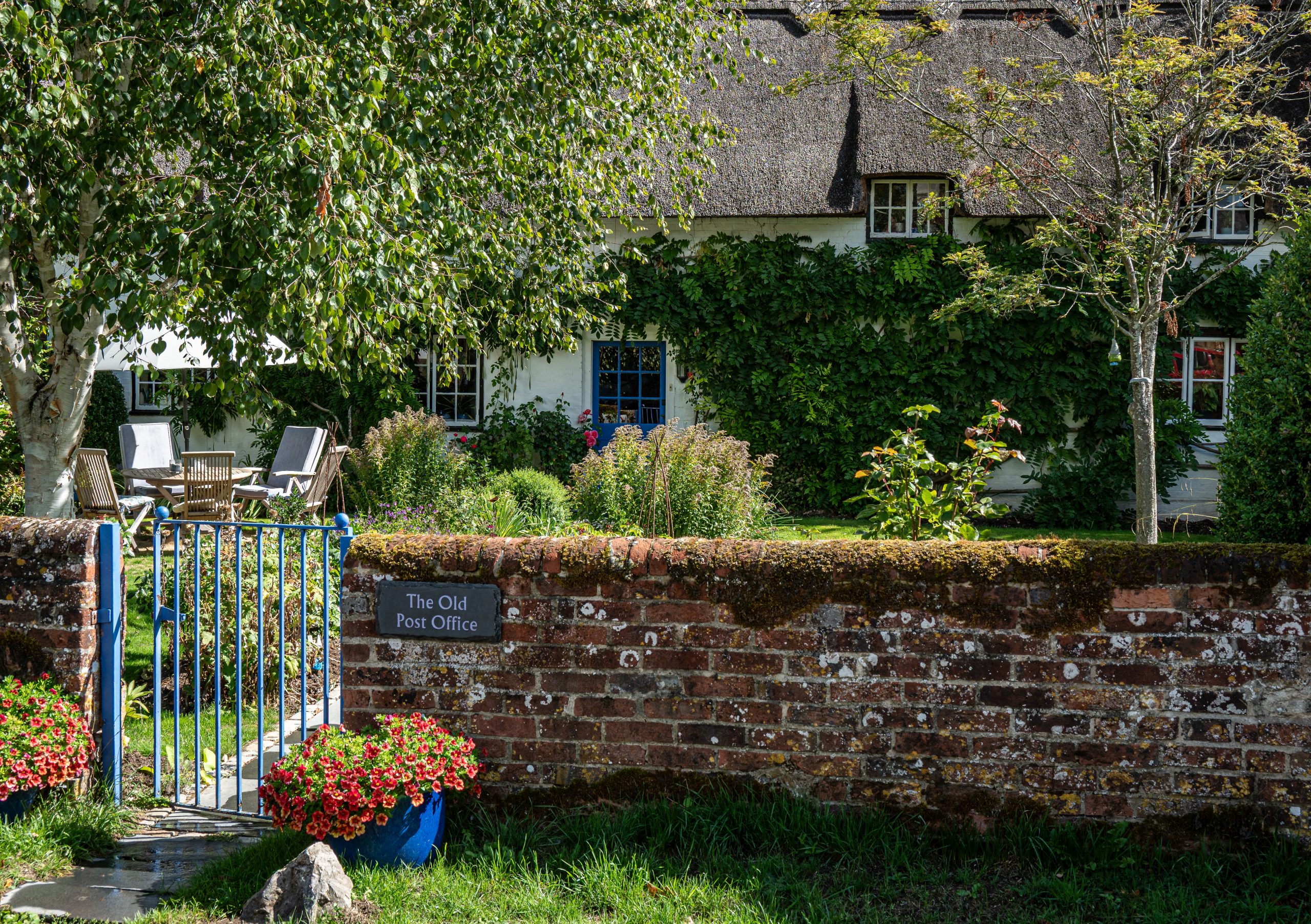 Traditional English village with thatched cottages.