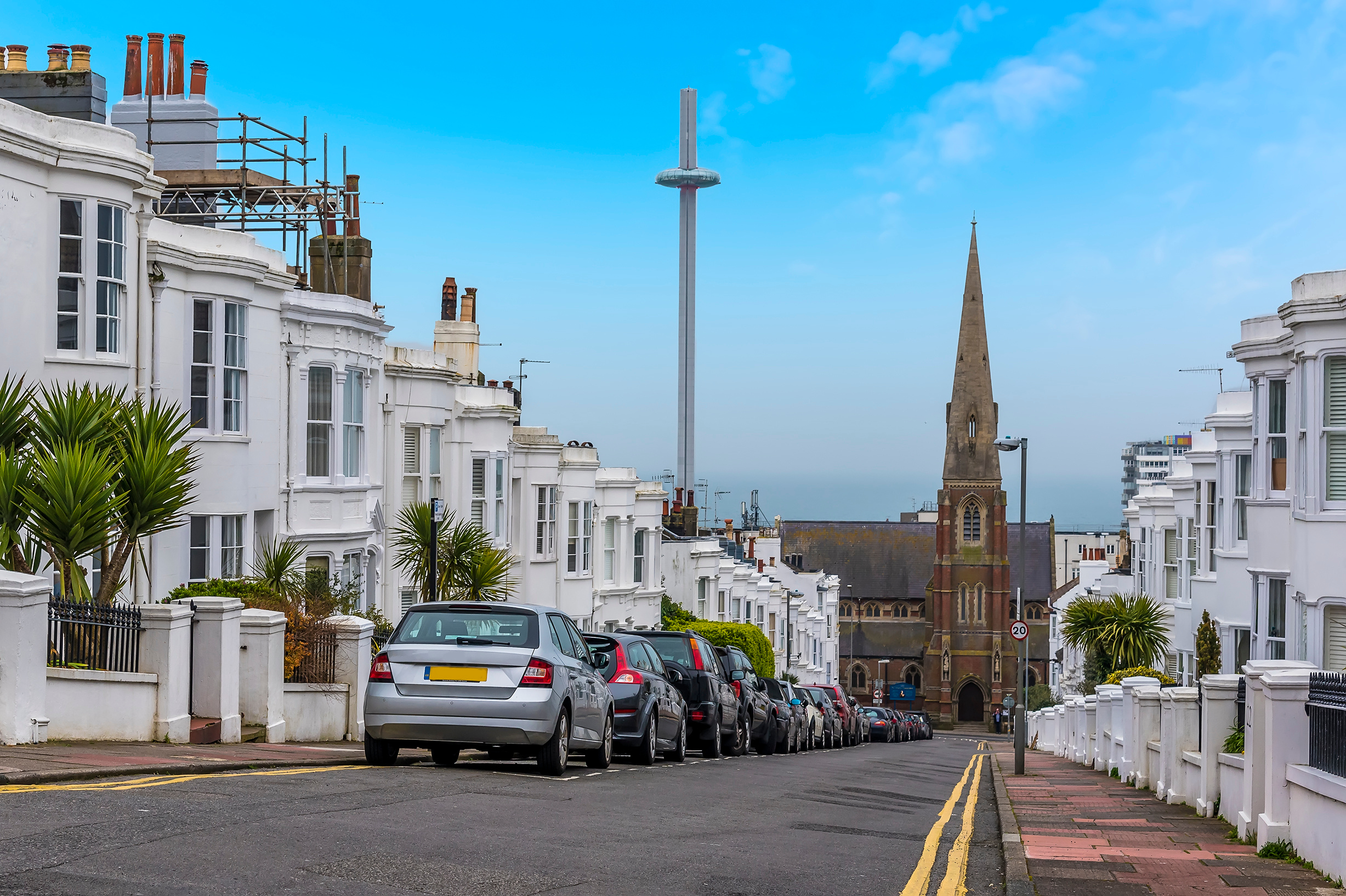 A view down a Georgian street in Brighton nd hove with contrasting old and new architecture on a sunny day
