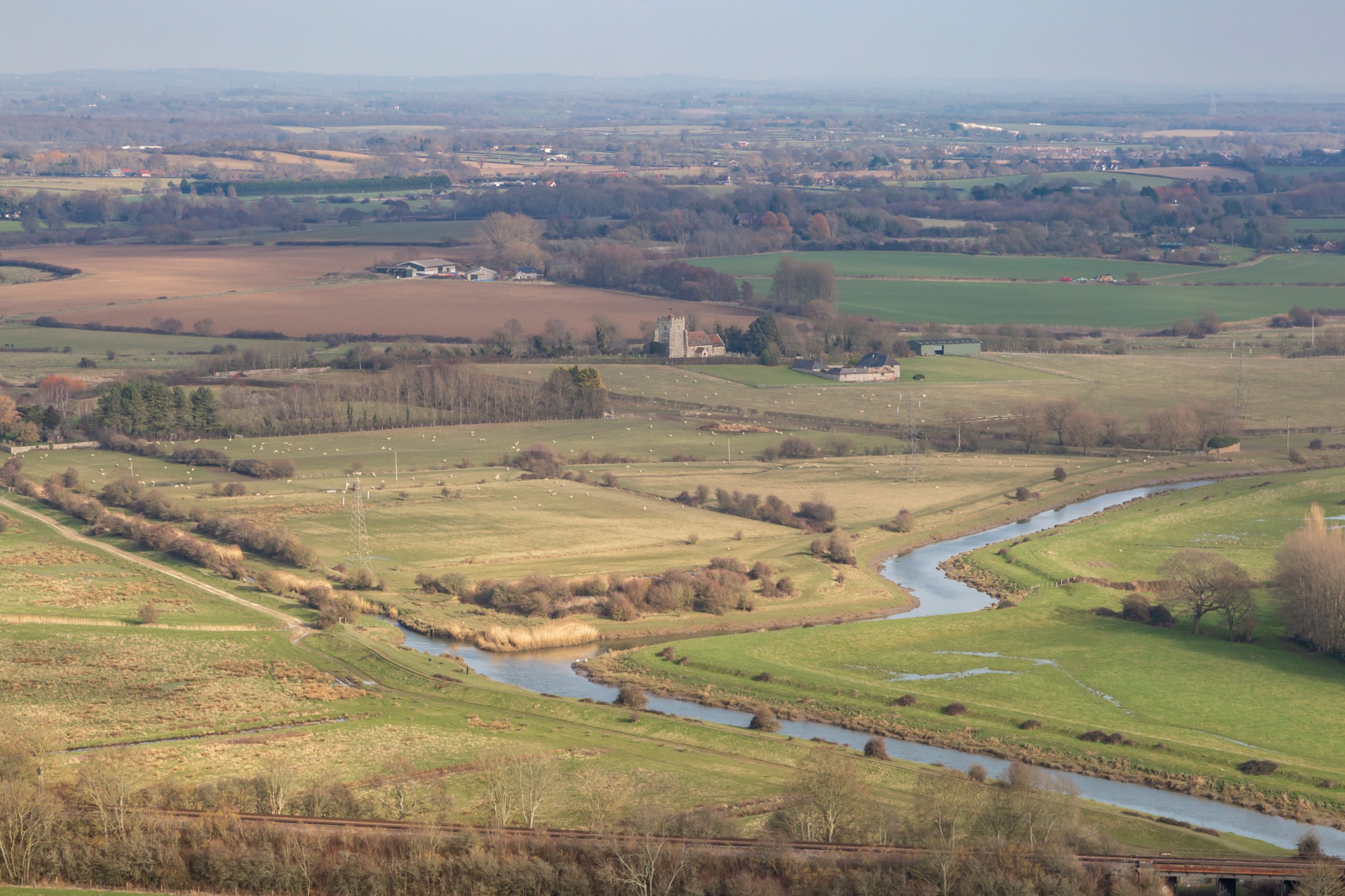 Looking out over the Sussex countryside near Lewes, towards the River Ouse and Hamsey Churc