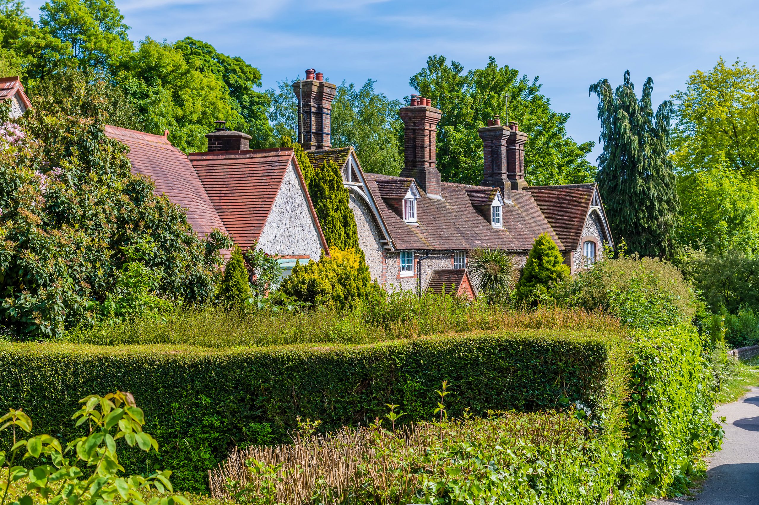 A view down the main street in the village of Stanmer, Sussex in summertime