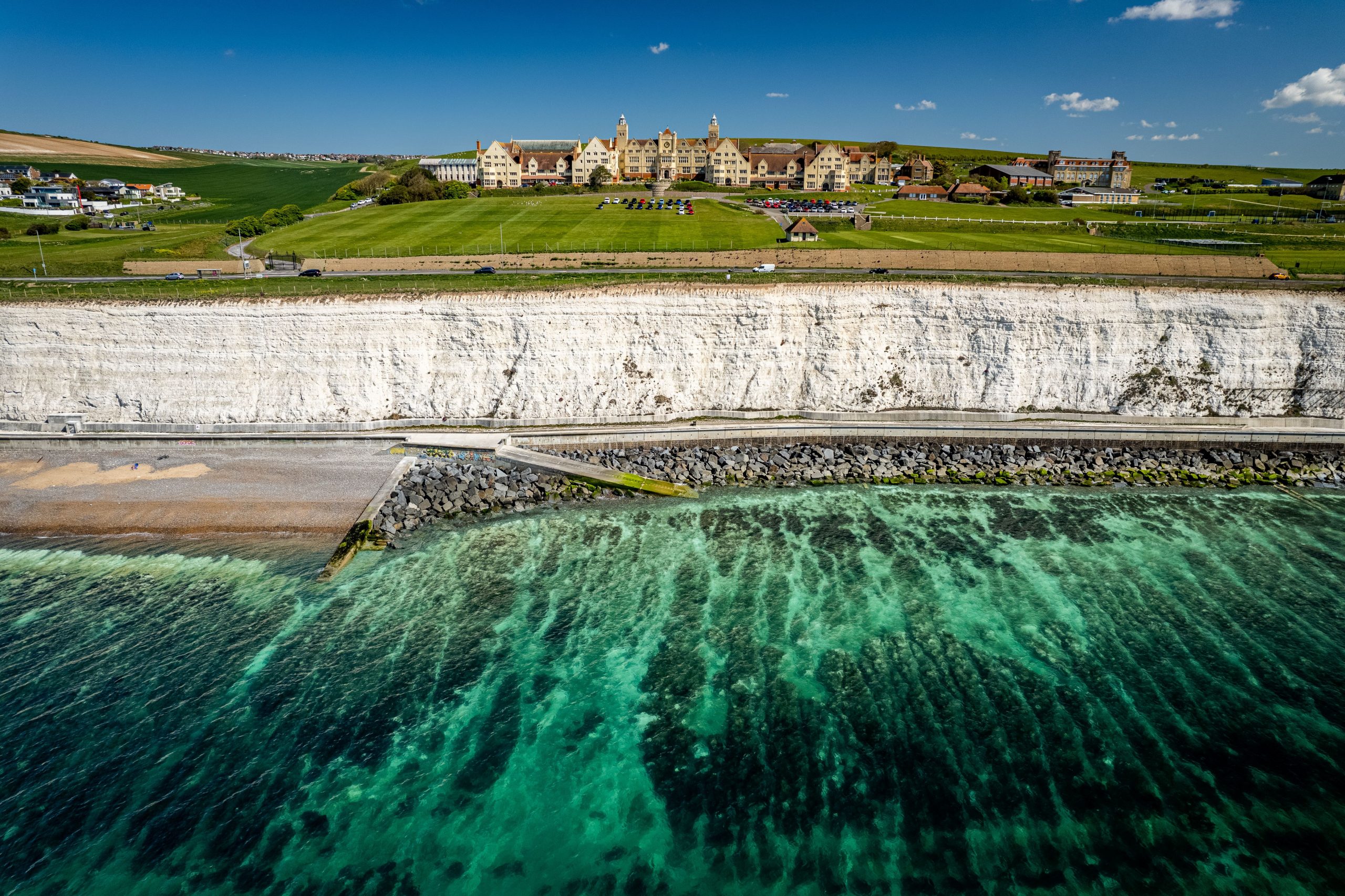 Scenic view of a Roedean School on the top of Sussex Downs in front of the sea, UK