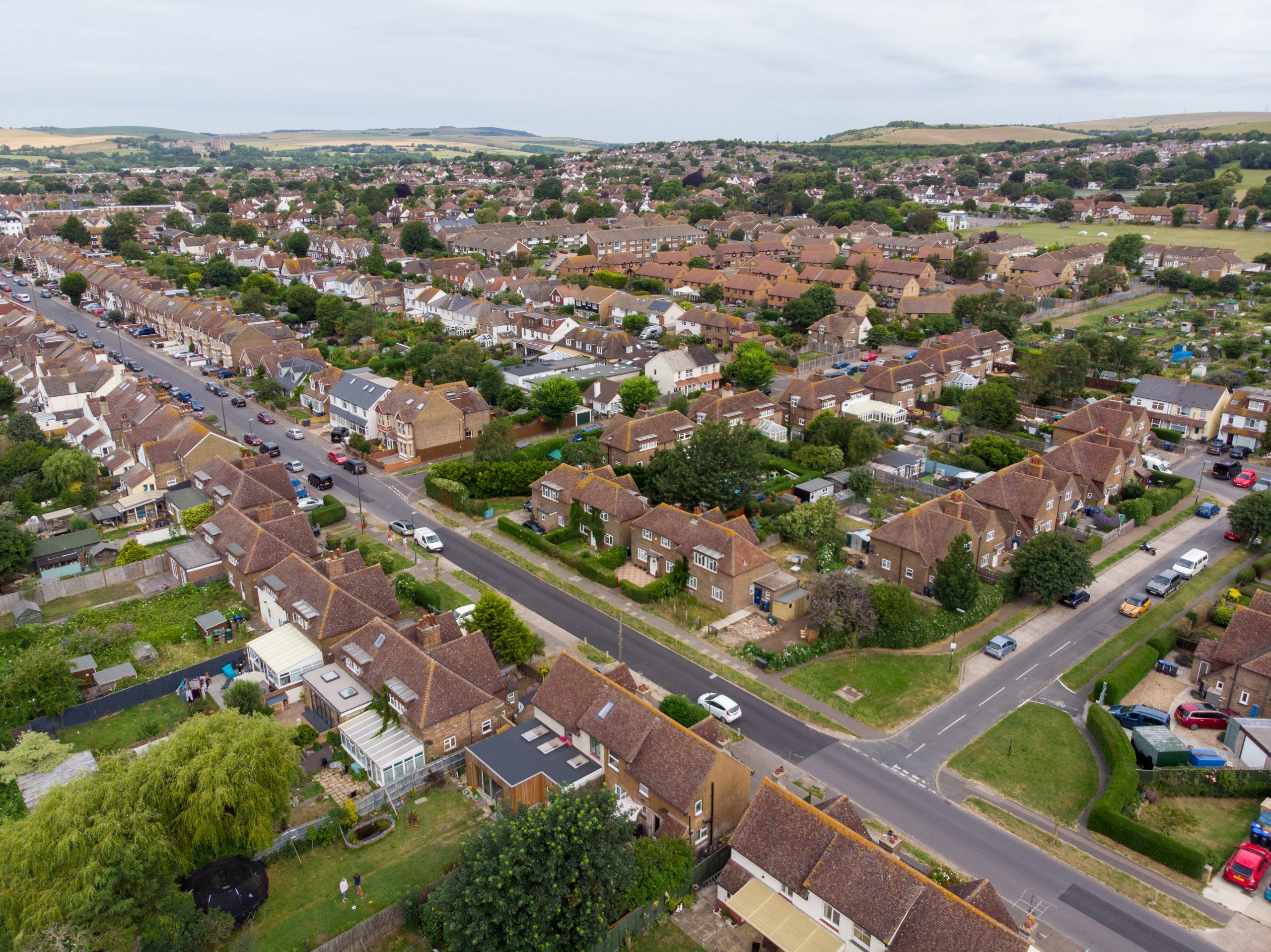 Aerial photo of the town of Shoreham-by-Sea, a seaside town and port in West Sussex, England UK, showing typical housing estates and businesses taken on a bright sunny day.